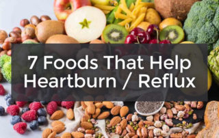 7 foods that help heartburn reflux with fruits, veggies & nuts in background