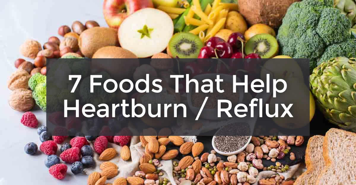 7 foods that help heartburn reflux with fruits, veggies & nuts in background