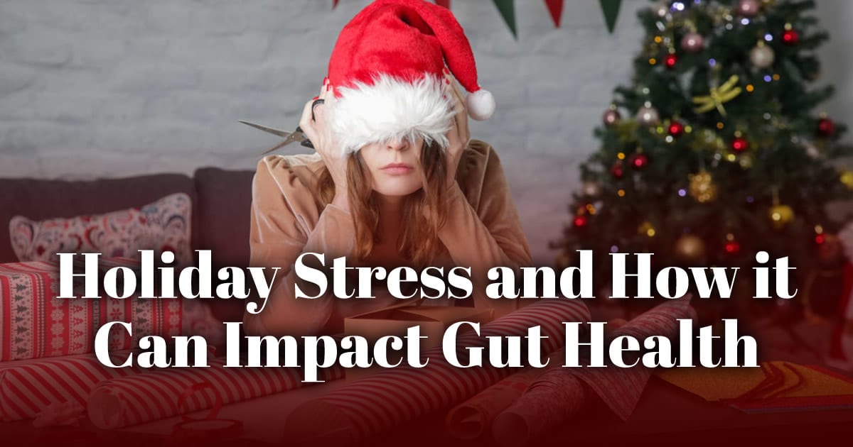 how holiday stress can impact gut health with frustrated lady in a santa hat pulled over her face in background
