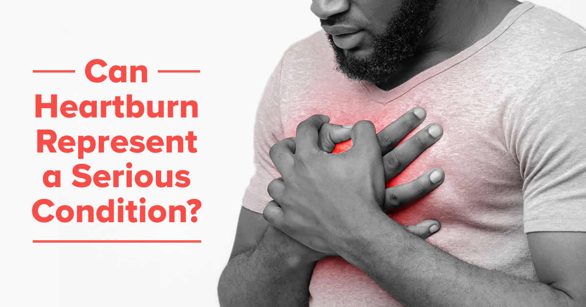 can heartburn represent a serious condition with man clutching chest in pain